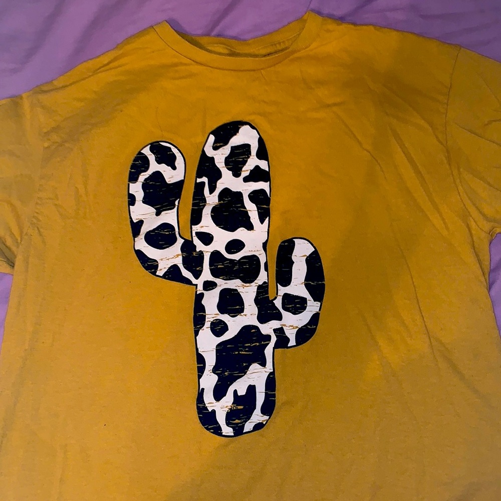 mustard yellow. cute shirt.